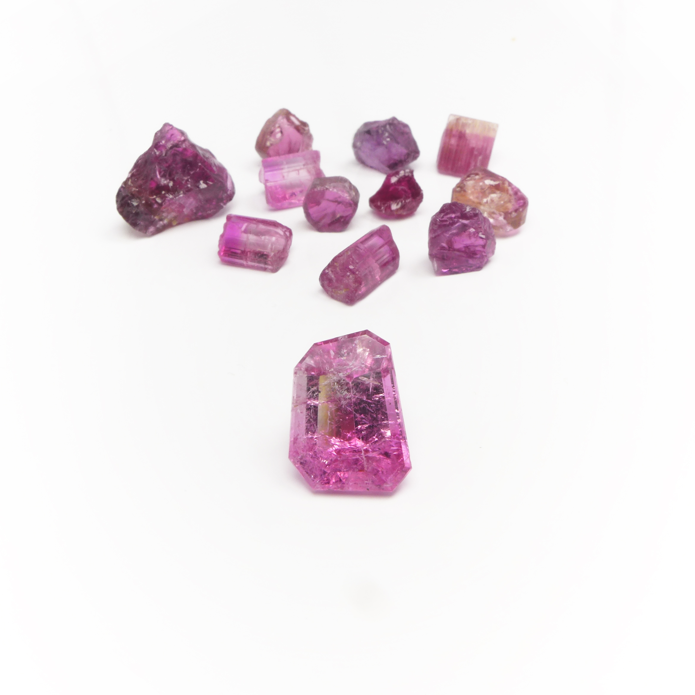 cut and rough pink turmalin stones